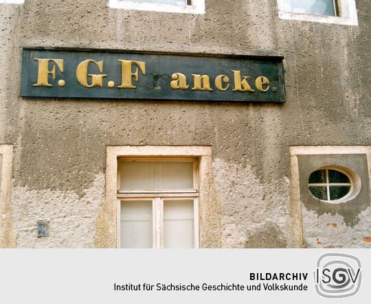 Firmenschild der Weinhandlung Francke in Bischofswerda