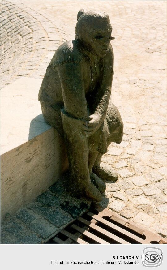 Markt Steinfiguren
Frau mit Stiefel