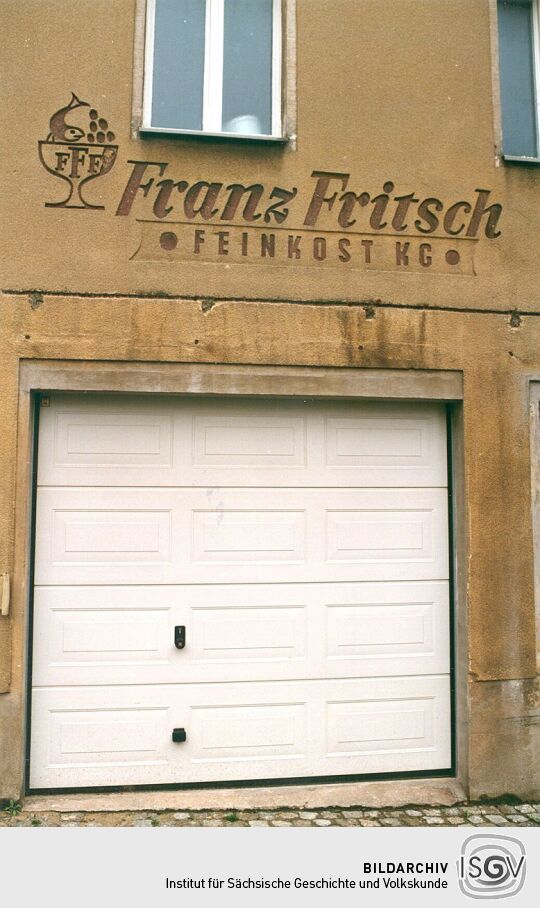 Alte Firmenreklame an einem Pulsnitzer Haus