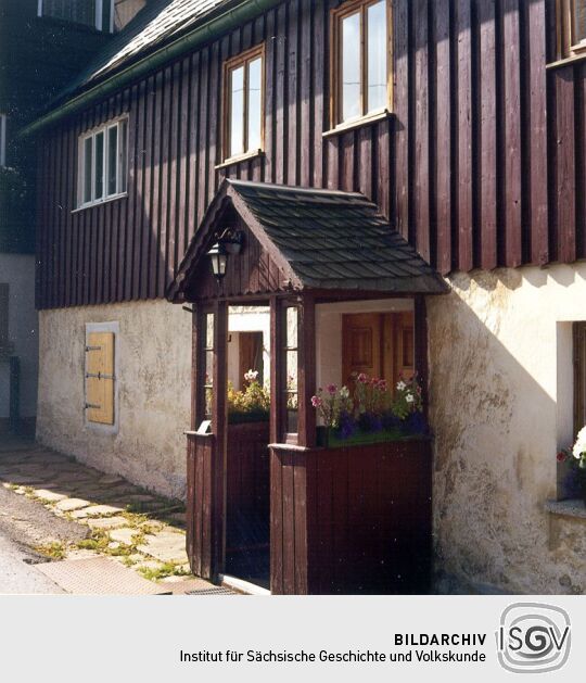 Verbrettertes Steinhaus in Geising