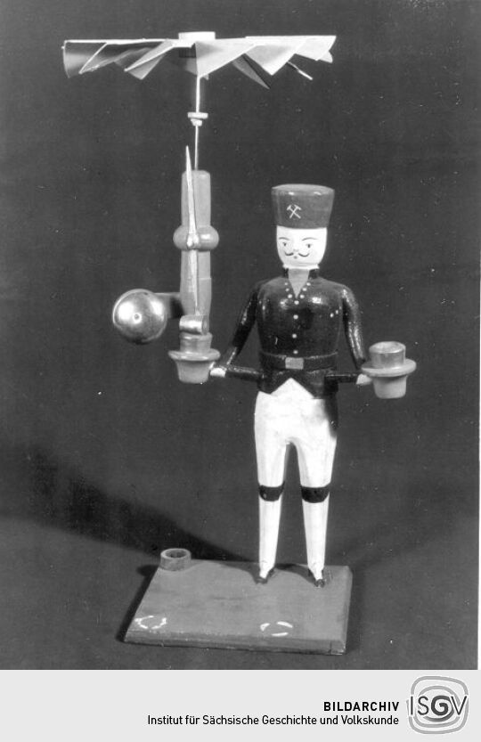 Bergmann mit Flügelrad