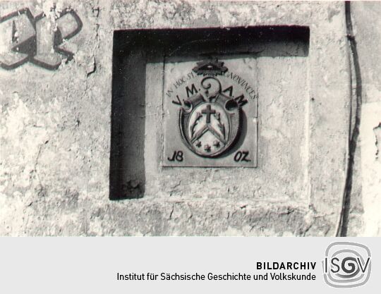 Wappen an einem Geschäft in Panschwitz